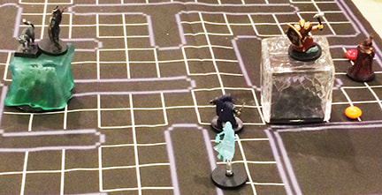 D&D minis on a PacMan battle grid dungeon maze