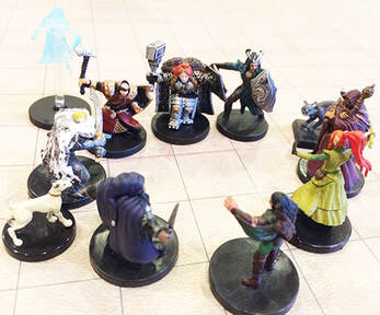 The Heroes converse and drink in a tavern (Dungeons and Dragons miniatures)