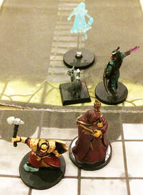 Lupin and Wanda the ghost testing the healing water (D&D miniatures)