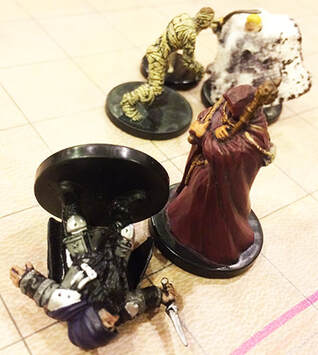 Dimva the Dwarf goes unconscious. (dungeons and dragons minis)
