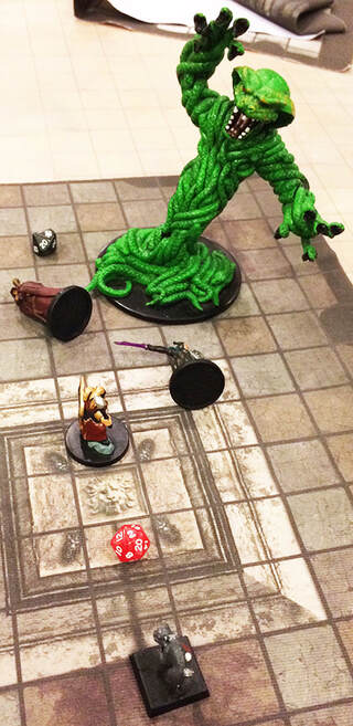 The heroes get trampled by a snake monster (dungeons and dragons minis)