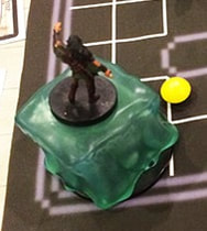 Erith captured by a gelatinous cube (D&D minis)