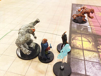D&D hero minis in a side room meeting an animal king.