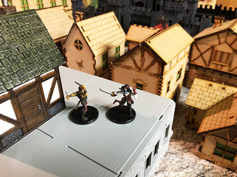 A swordfight on a rooftop (D&D minuatures)